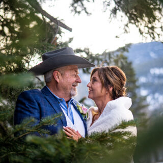 newly married couple gazes at each other in RMNP